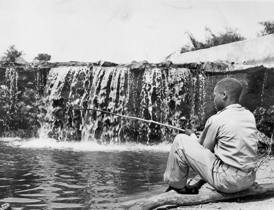 #110 David Singleton fished below the spillway at Birchin Lake in Nottoway County, 1948.