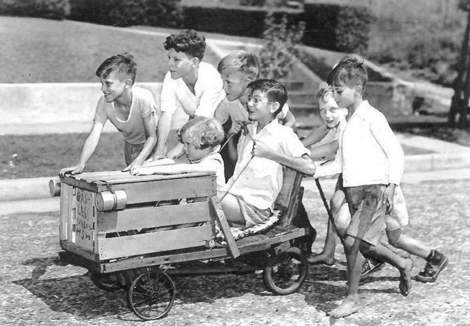 #117 Children took a homemade cart for a spin along North 19th Street in Richmond, 1941.
