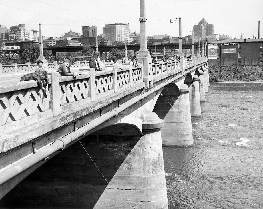 #141 Fishing enthusiasts came out to enjoy the bright sunshine on the Mayo Bridge in downtown Richmond, 1946. High temperatures matched the 1925 record of 90 degrees.