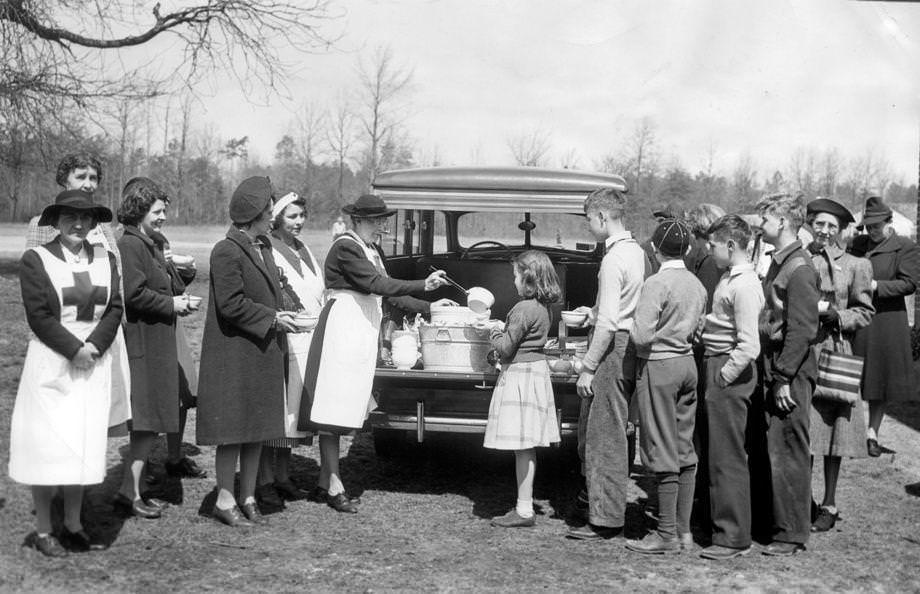 #147 Mrs. Tazewell Perrow served soup to children from Bon Air School from the first mobile canteen for Chesterfield County, 1942.
