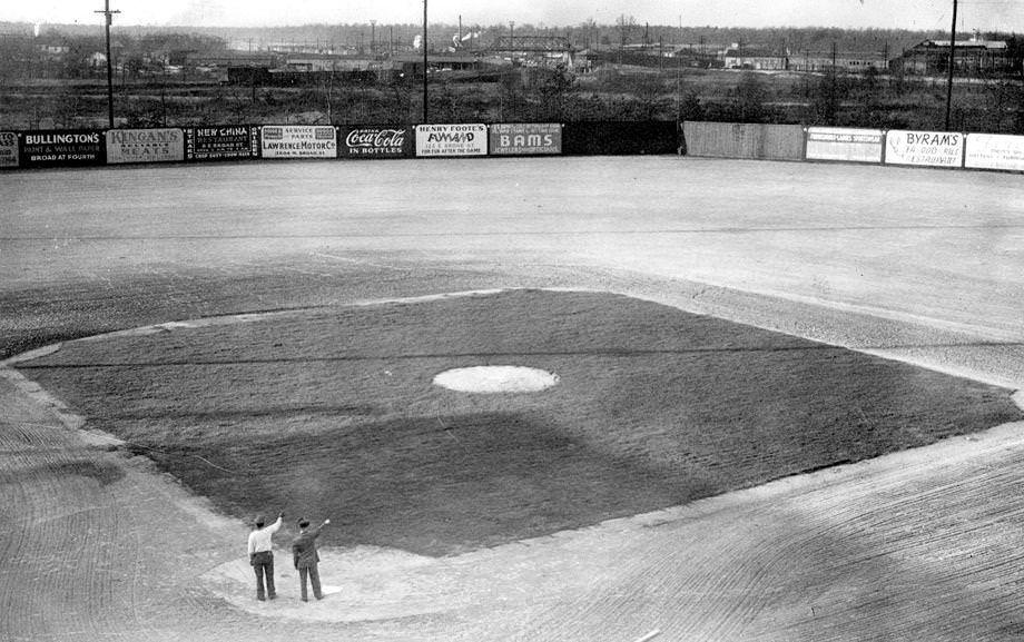 #153 Mooers Field, with grass throughout the infield but dirt beyond, 1946.