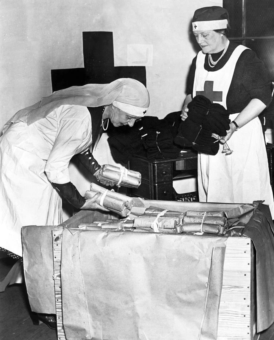 #177 Mrs. St. George Bryan and Mrs. Lawrence Price helped pack more than 1,000 sweaters, socks, afghans and other items knitted by Richmond volunteers, which were being sent to the Red Cross “Mercy Ship” that sailed in June to deliver war relief to Europeans.