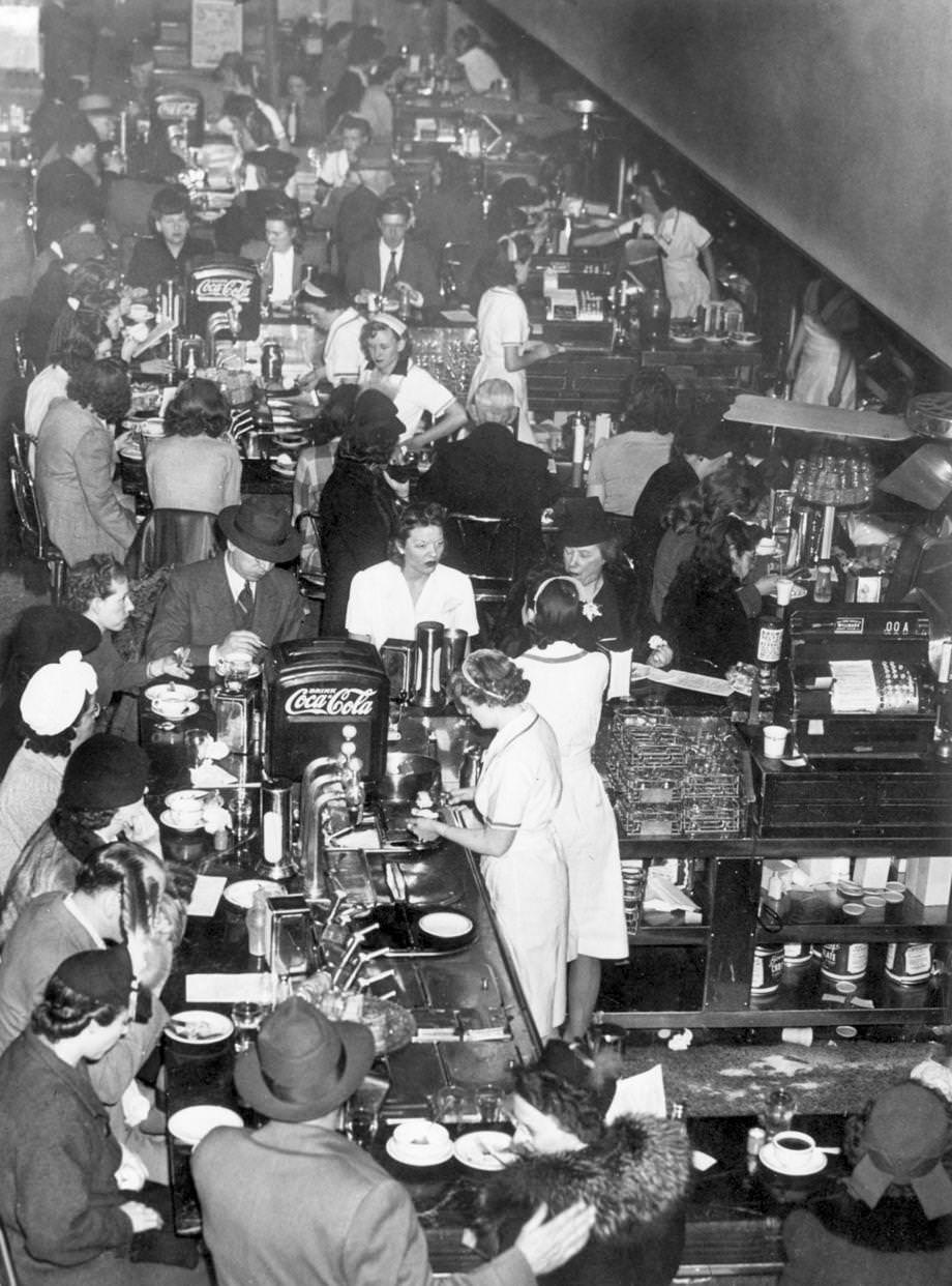 #180 The restaurant at a Peoples Drug Store in Richmond was bustling, 1943.