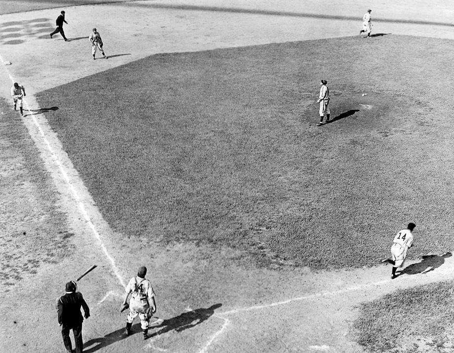 #181 A Richmond Colts batter headed to first base while a teammate scored in a victory over the Norfolk Tars in a Piedmont League game at Tate Field, which was on Mayo Island in Richmond, 1940.