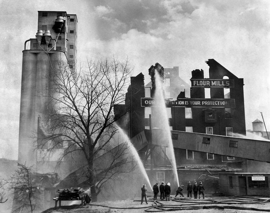#182 Smoldering embers and charred, jagged walls were all that remained of the Dunlop Mills in South Richmond, 1949.