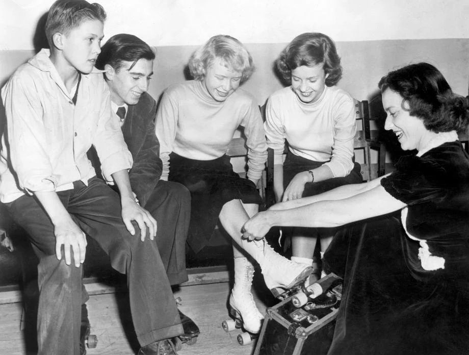 #187 Richmond teens put on their roller skates at the Cavalier Arena with some help from city recreation department employee Jane Hemby, 1948.