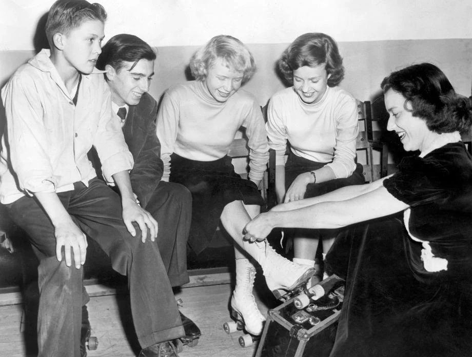 #188 Richmond teens put on their roller skates at the Cavalier Arena with some help from city recreation department employee Jane Hemby, 1948.