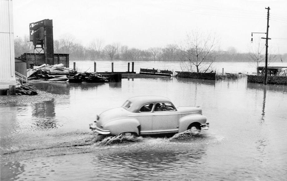 #56 High water on Dock Street in downtown Richmond followed a brief flood that caused no damage, 1949.