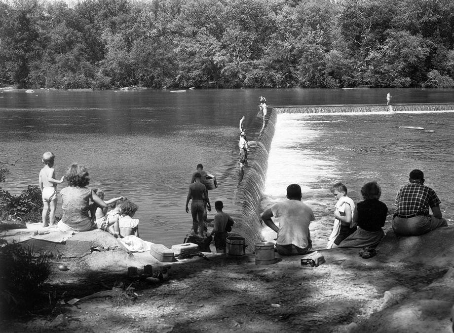 #89 Area residents enjoyed a refreshing swim in the James River — a reprieve from record high temperatures during the spring month, 1956.