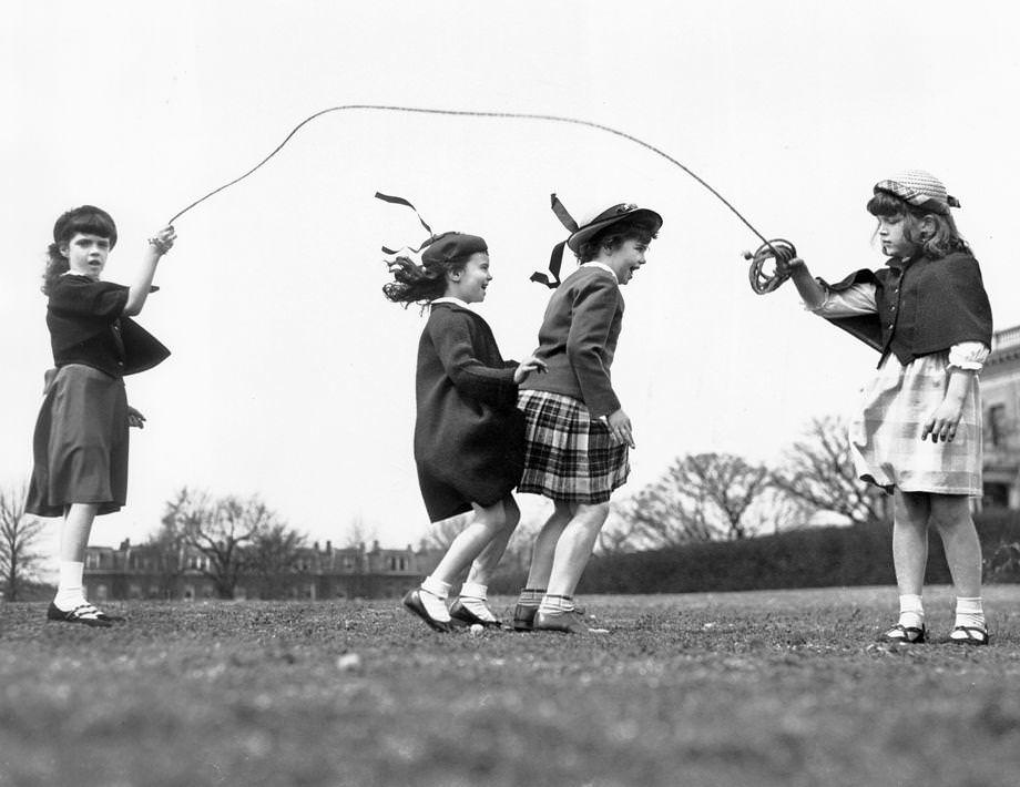 #90 Four girls played jump-rope in a Richmond city park, 1950.