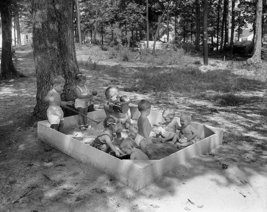 #160 Children playing on the Westwood Terrace playground, 1950. Some new homes in the development were offered for less than $10,000 that year.