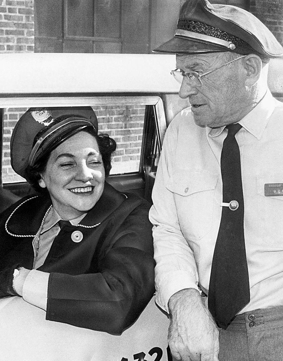 #184 Jewell Mason, one of Richmond’s few female cab drivers, chatted with her husband, Otha, who also drove cabs, 1950s.