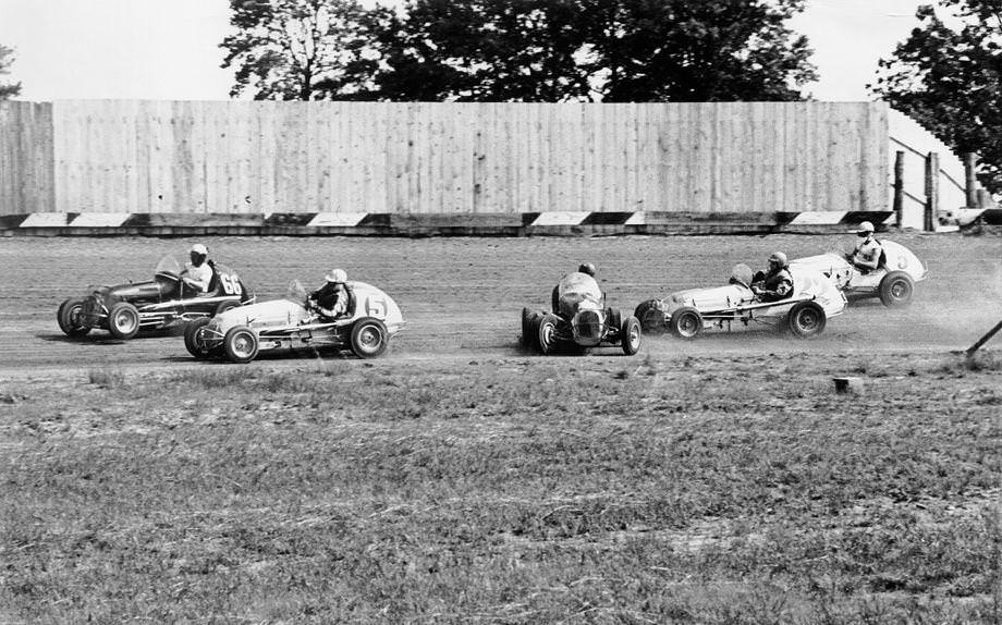 #194 Bill Shockley of Greenville, S.C., spun out in an eight-lap midget auto heat on the half-mile dirt track at the State Fairgrounds, 1958.