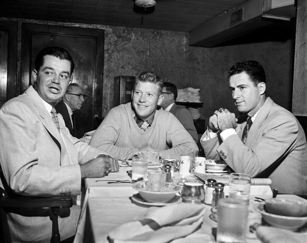 #211 New York Yankee star Mickey Mantle (center) had breakfast with teammates Bill Miller (left) and Jerry Coleman at the Hotel John Marshall before the team played the Richmond Virginians on April 8, 1954, to open Parker Field.