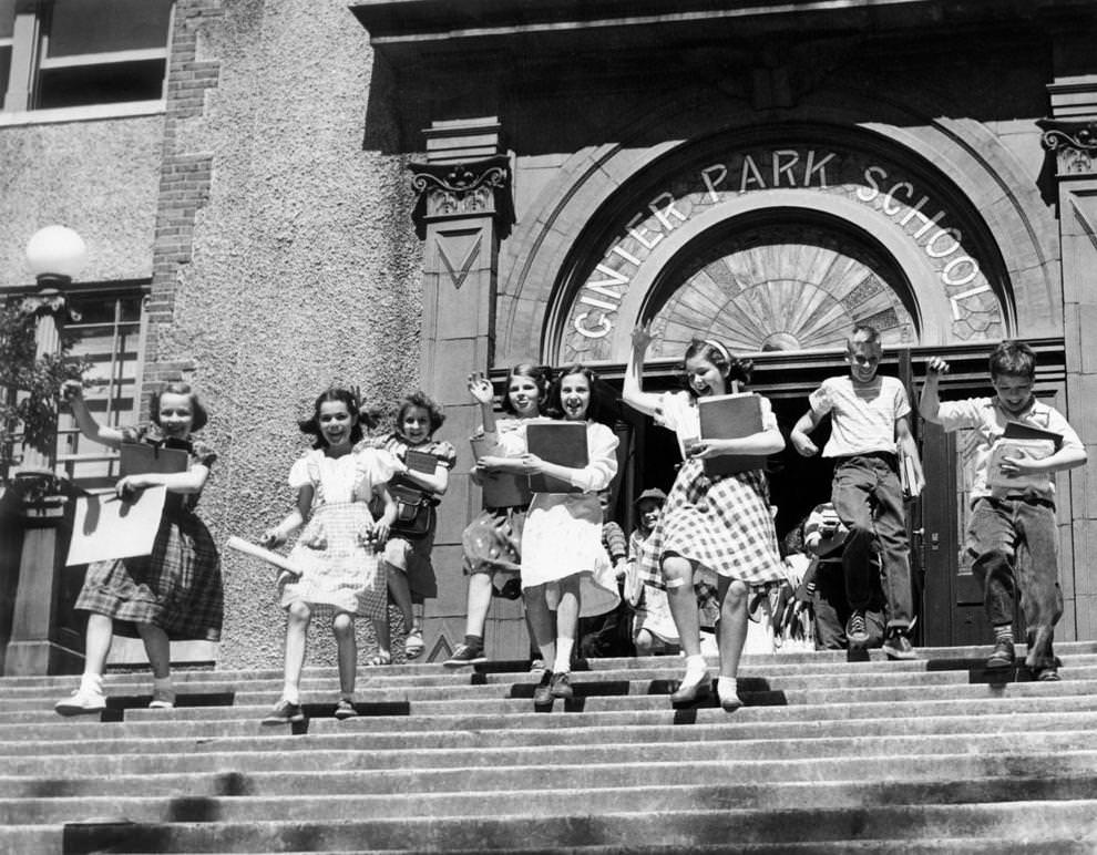 #216 Gleeful children left Ginter Park School in Richmond as they were dismissed for the summer months – though they did need to return a few days later for their report cards, 1950.