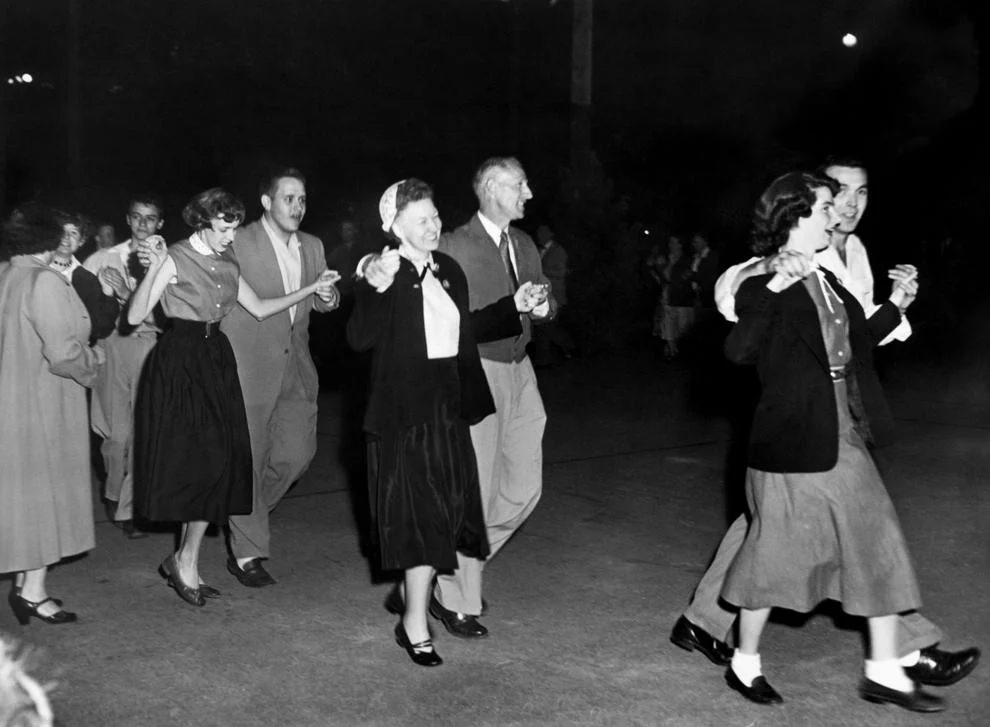 #225 Richmonders attended a square dance at the Byrd Park tennis courts to kick off Park and Recreation Week. Other events included festivals, concerts, games and exhibits, 1954.