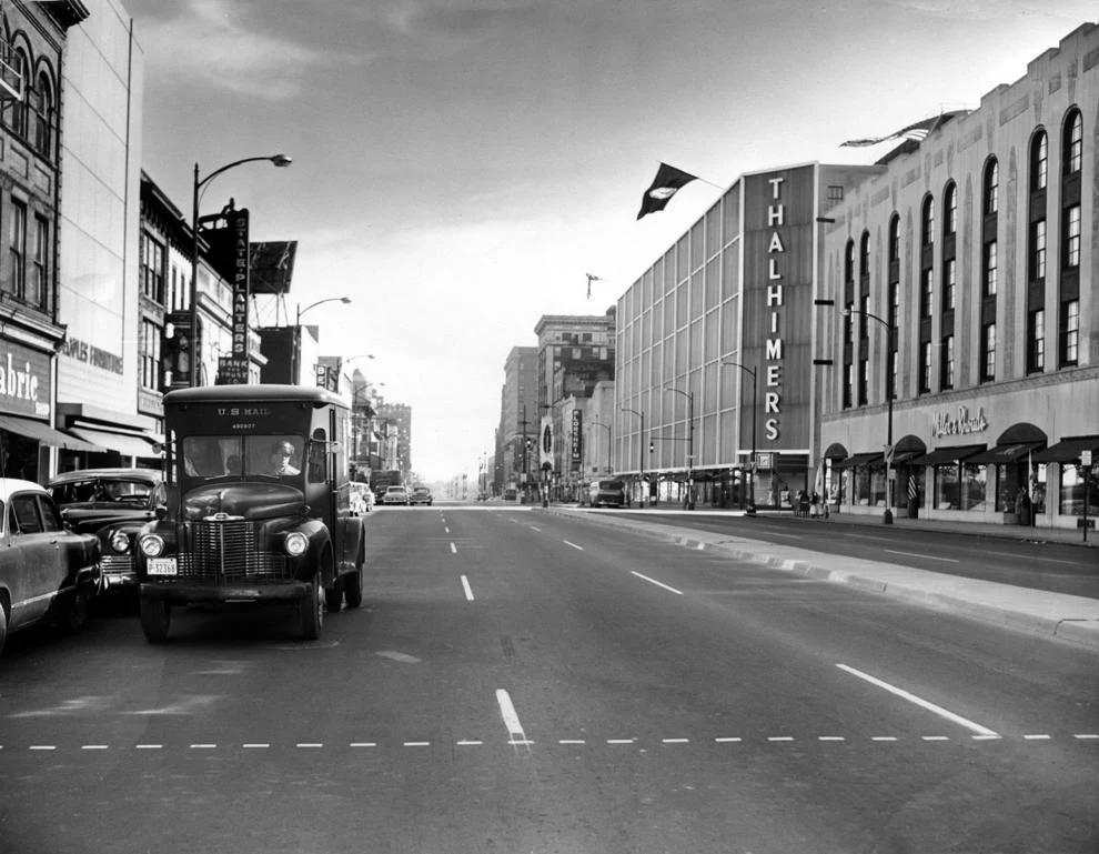 #234 A U.S. mail truck navigated Broad Street downtown across from the Thalhimers and Miller & Rhoads department stores, 1955.