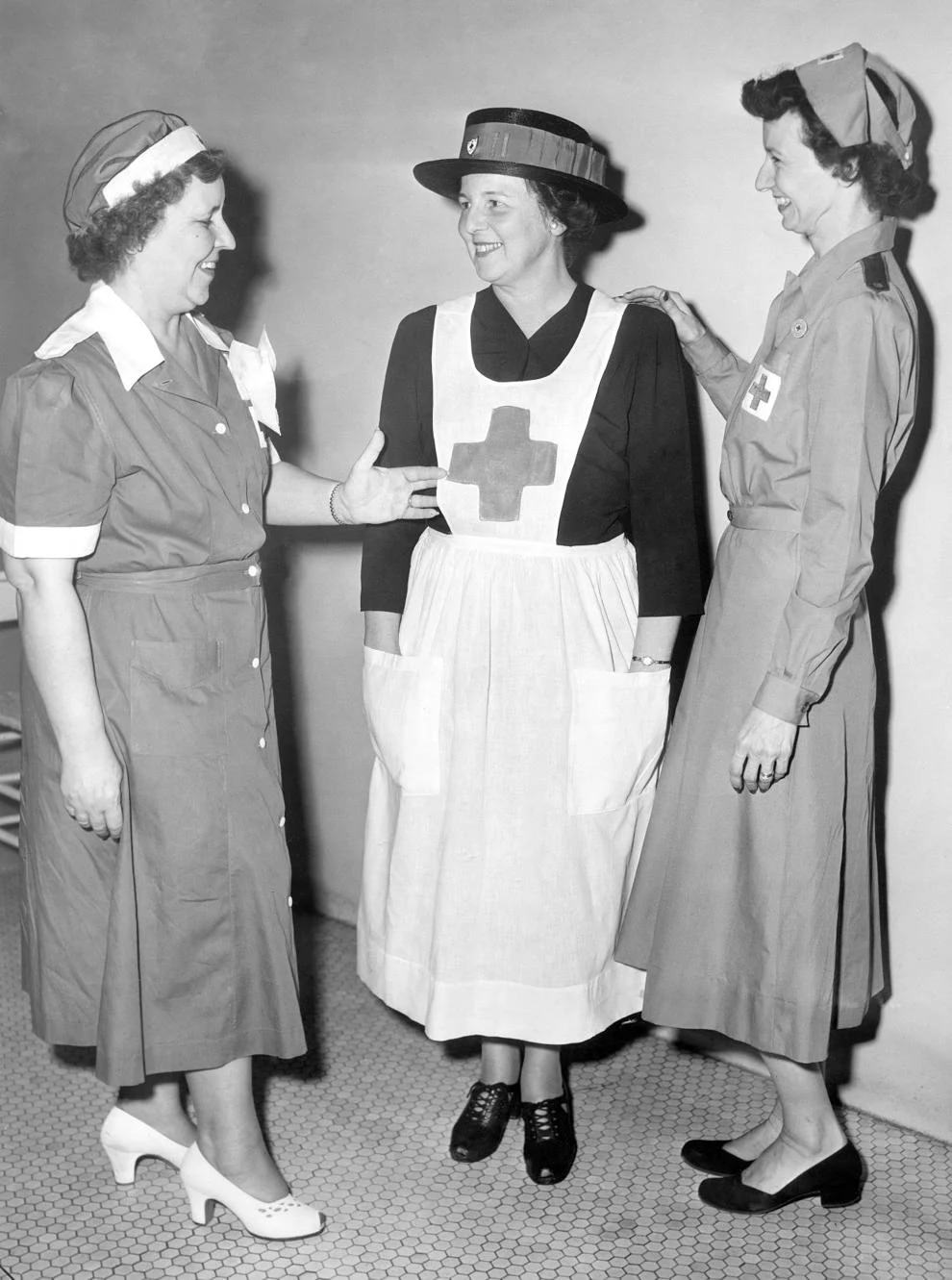 #240 Three American Red Cross canteeners, representing three war periods, gathered for the Richmond chapter’s rally marking the graduation of the first group of canteeners to be trained since World War II, 1951.