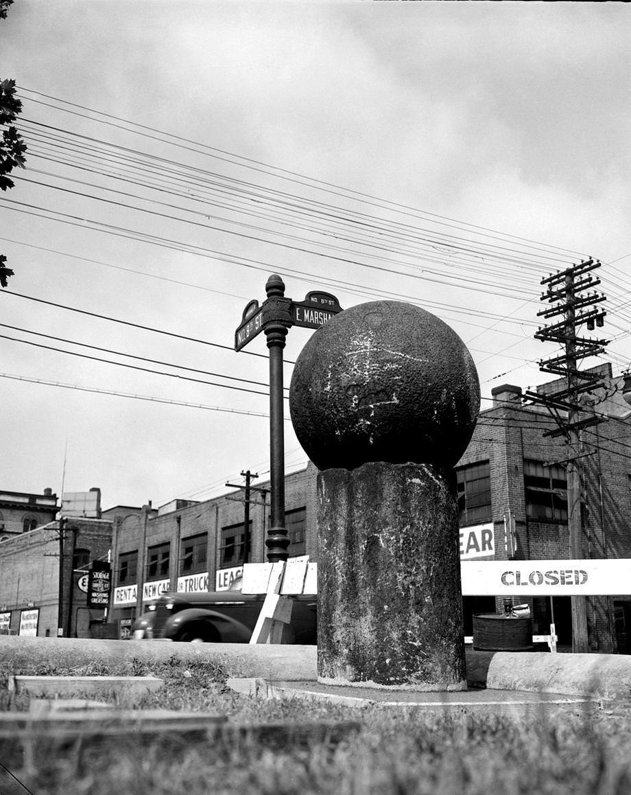 #30 One of “Dr. Duval’s pills,” part of a trio of 30-inch granite Turkish cannonballs, in its new location at John Marshall High School at Eighth and Marshall streets in Richmond, 1952.