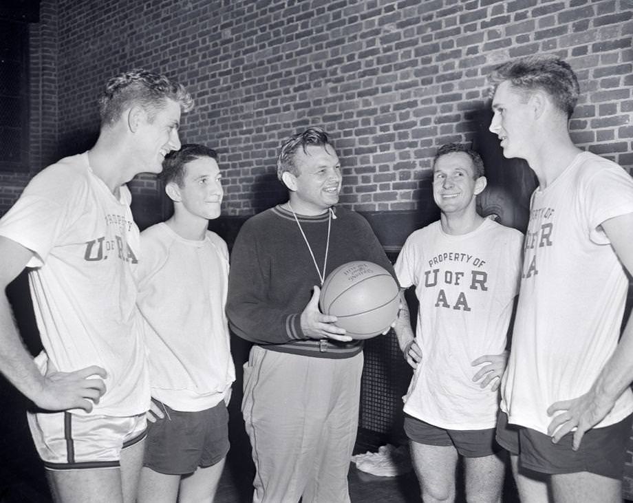 #38 University of Richmond basketball coach Les Hooker was surrounded by four returning members from the previous season’s team, which won the Big Six title in Hooker’s first season and earned him coach of the year honors, 1953.