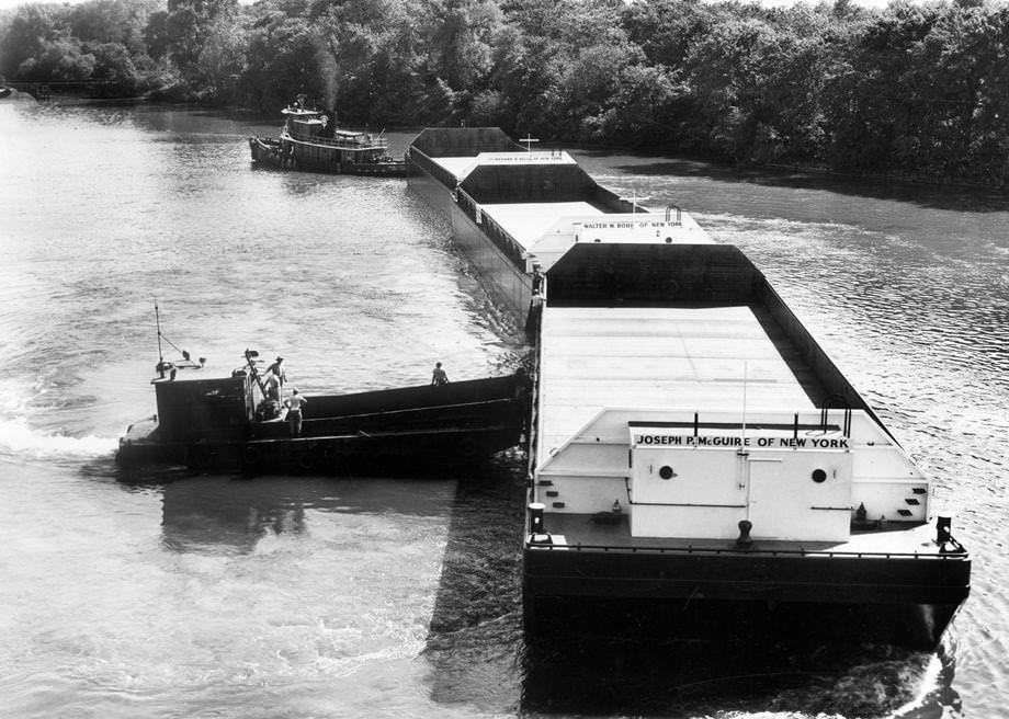 #76 A tugboat from New York City left Richmond’s Upper Terminal with three steel barges in tow, 1955.