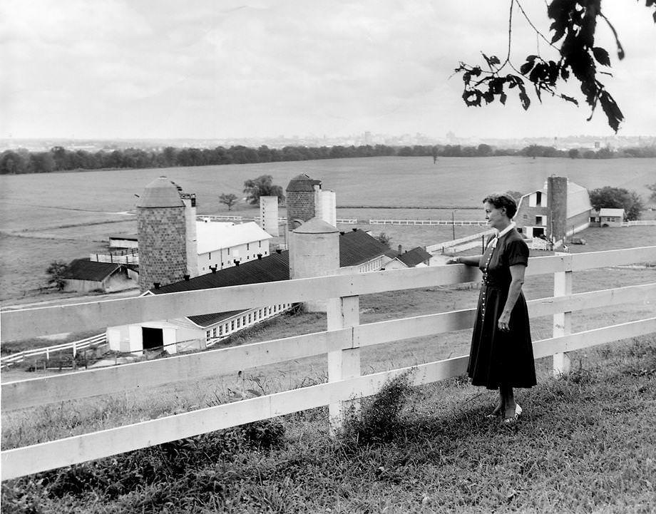 #80 Mrs. Burlee stood on her front lawn at Tree Hill Farm in Henrico County’s Varina area and admired the view of Richmond, 1955.