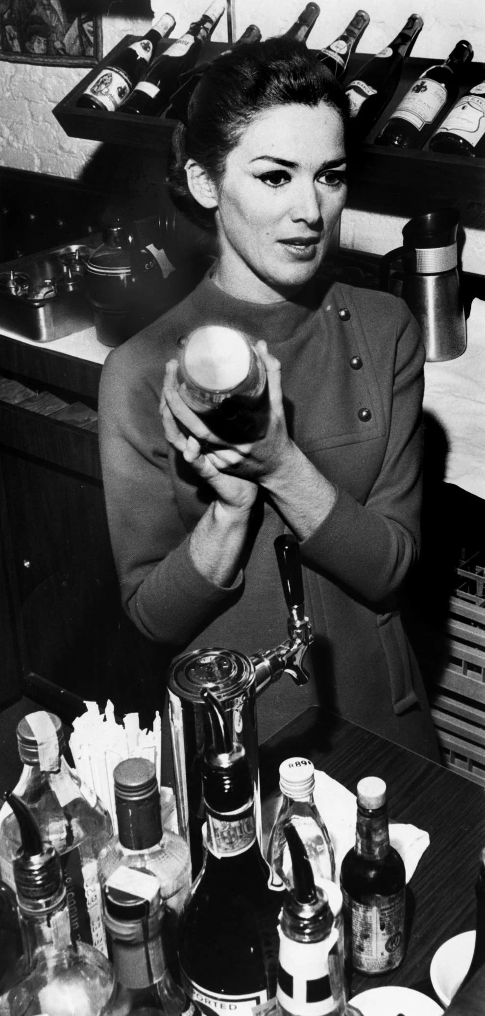 #93 Kimberly Farmer mixed a drink at Michael’s, a restaurant on Fifth Street in Richmond, 1969.