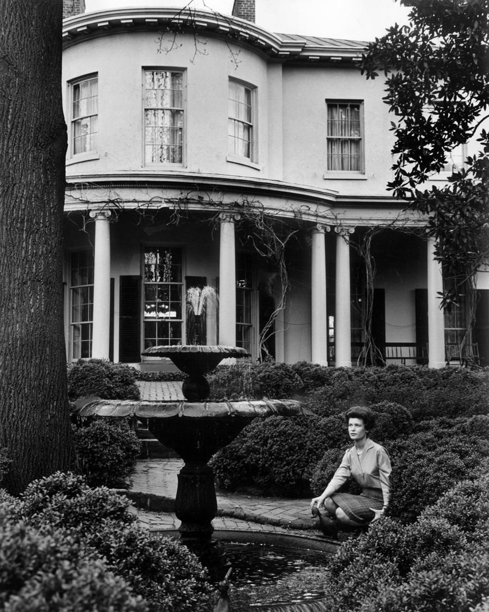 #109 Nancy Beth Heller took a break from her duties at the Wickham-Valentine House in Richmond to enjoy the garden, 1968.