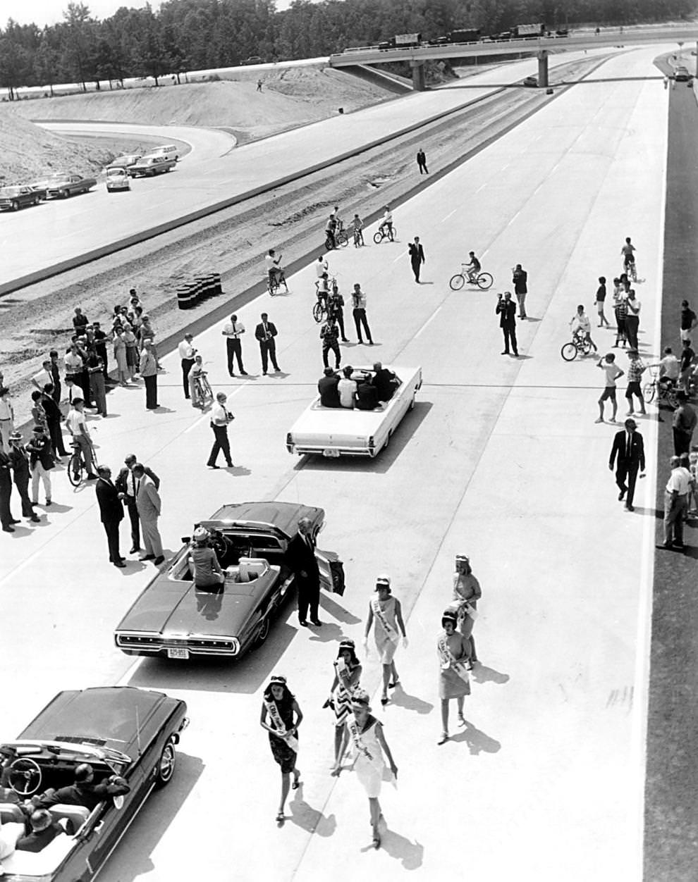 #116 Beauty queens and convertibles gathered on Interstate 64 to celebrate a new 9-mile stretch of highway from the Bryan Park area at I-95 to Short Pump in Henrico County, 1967.