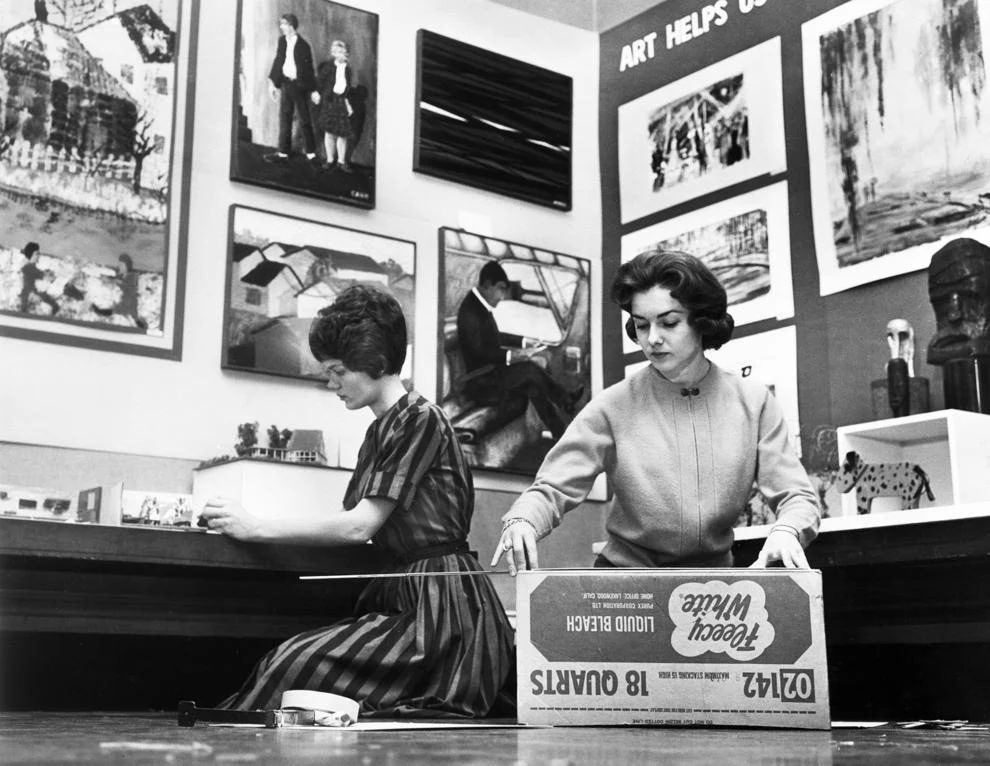 #129 Art teachers Mrs. Richard T. Willis (left) and Gayle Dean unpacked student artwork for exhibition at The Valentine museum in downtown Richmond, 1963.