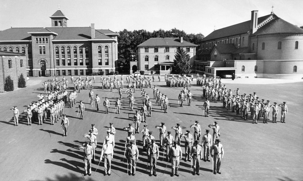 #14 The Benedictine cadet corps stood in formation behind the high school, which was celebrating its 50th anniversary that fall, 1961.