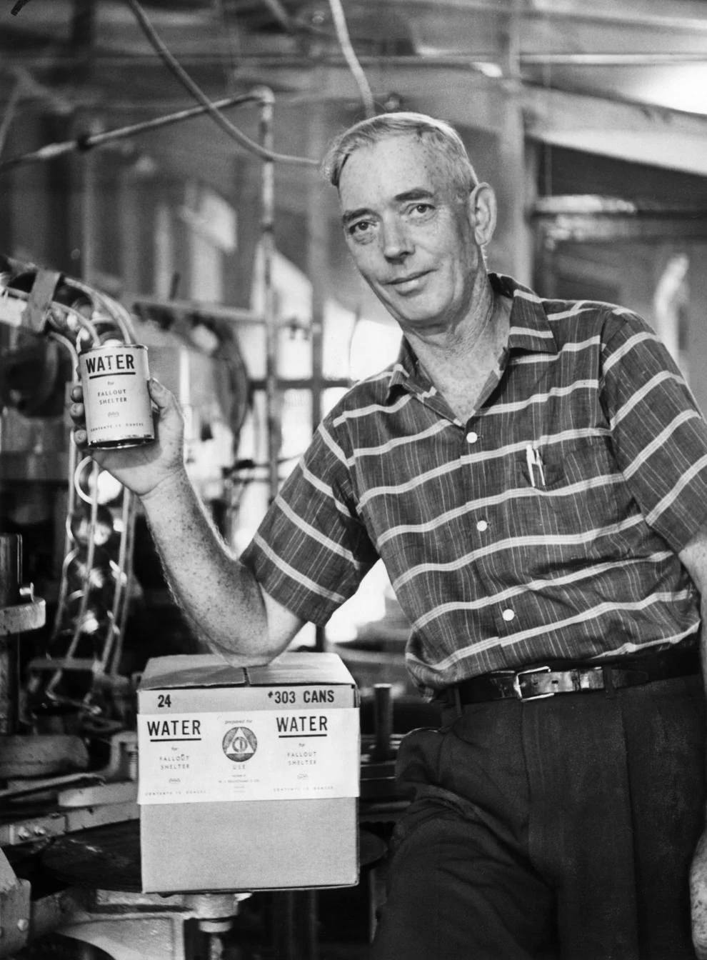 #142 W. Irving Beauchamp displayed his new product: canned water, 1961.