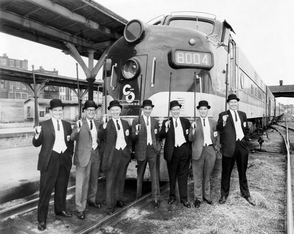 #30 The salesmen for the Chesapeake and Ohio Railway posing in front of a train, 1962.
