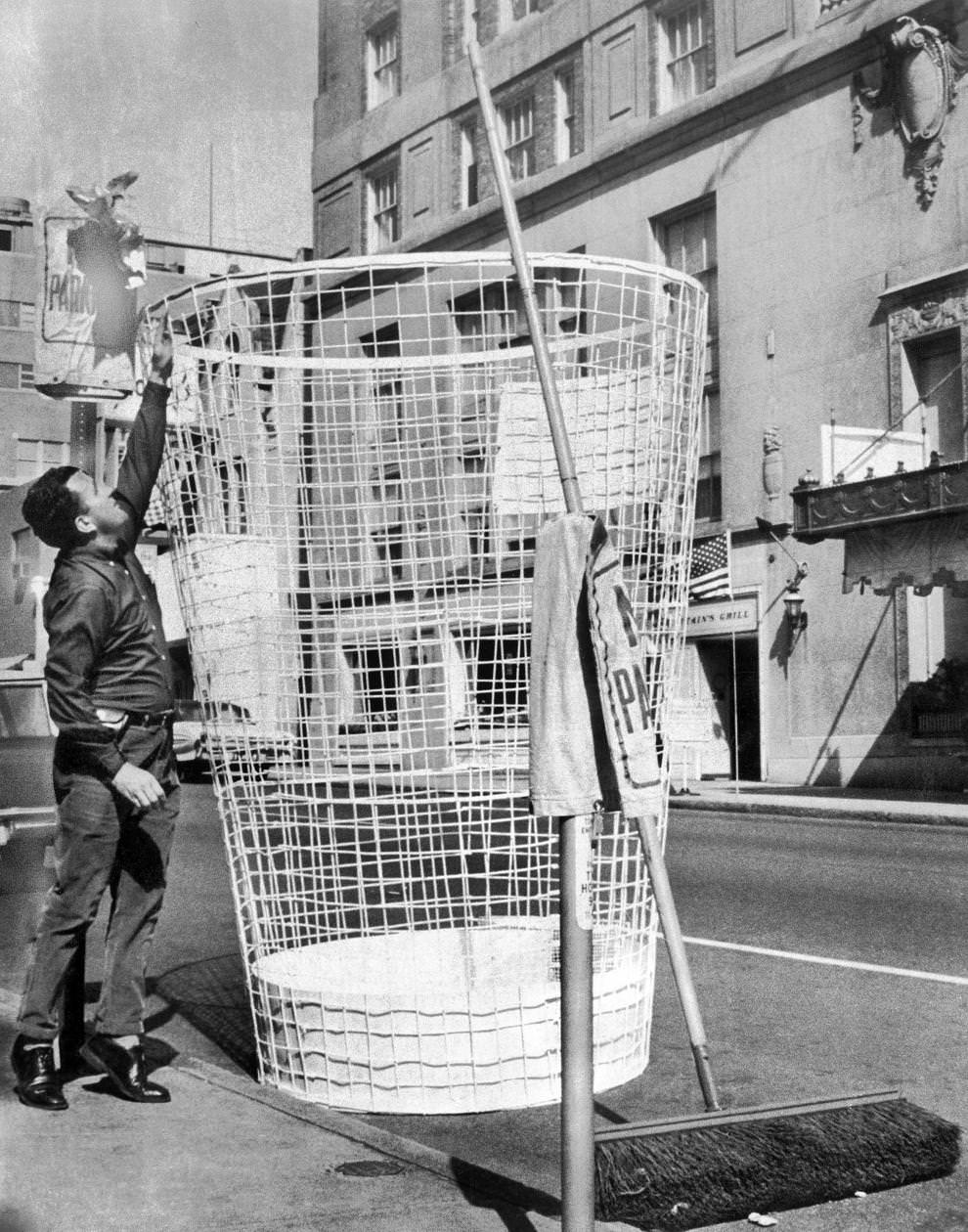 #35 A huge trash bin was displayed on Fifth Street in downtown Richmond to dramatize an ongoing anti-litter campaign, 1965.