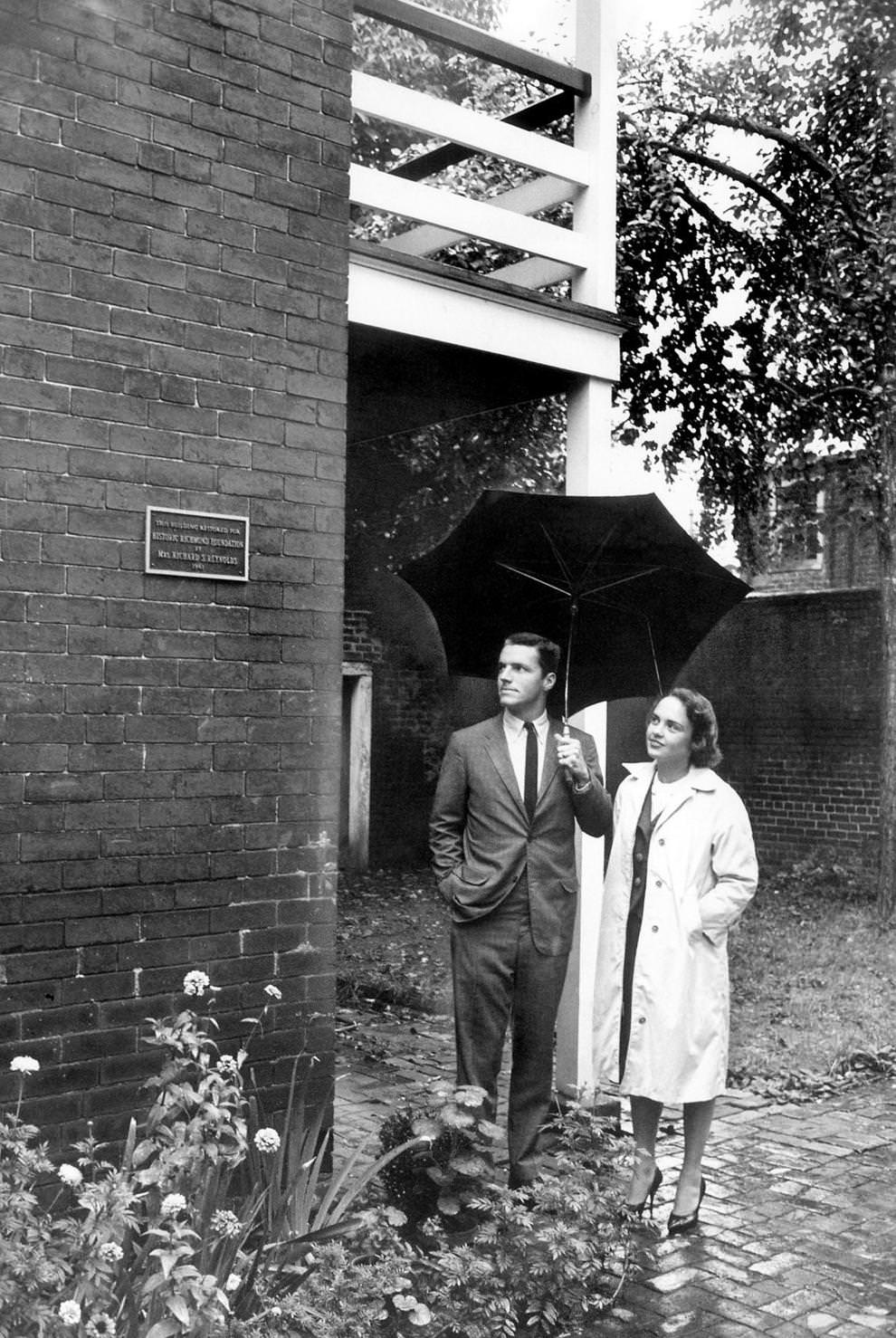 #53 Frederic S. Bocock of the Historic Richmond Foundation and Mrs. Cornelius F. Florman stood in front of one of four new plaques honoring patrons of Church Hill renovations in Richmond, 1962.