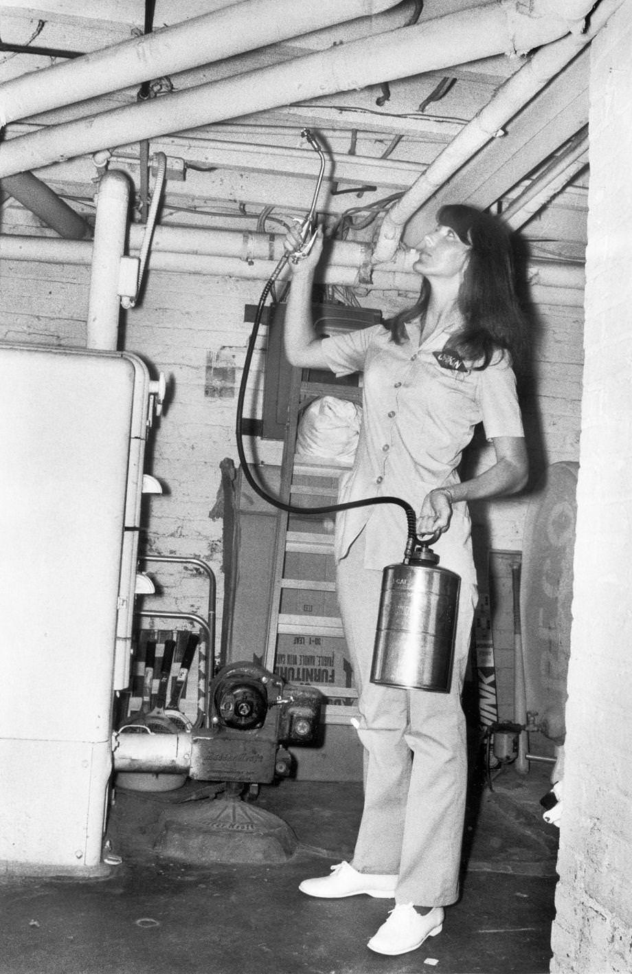#121 An exterminator Linda Summerlin sprayed pest control in a customer’s basement, 1973.