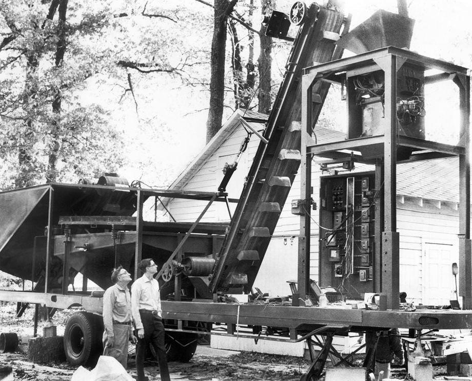 #147 Noah G. Teates Sr. (left) and son Grove operated a machine outside the family’s Hanover County home, 1971.