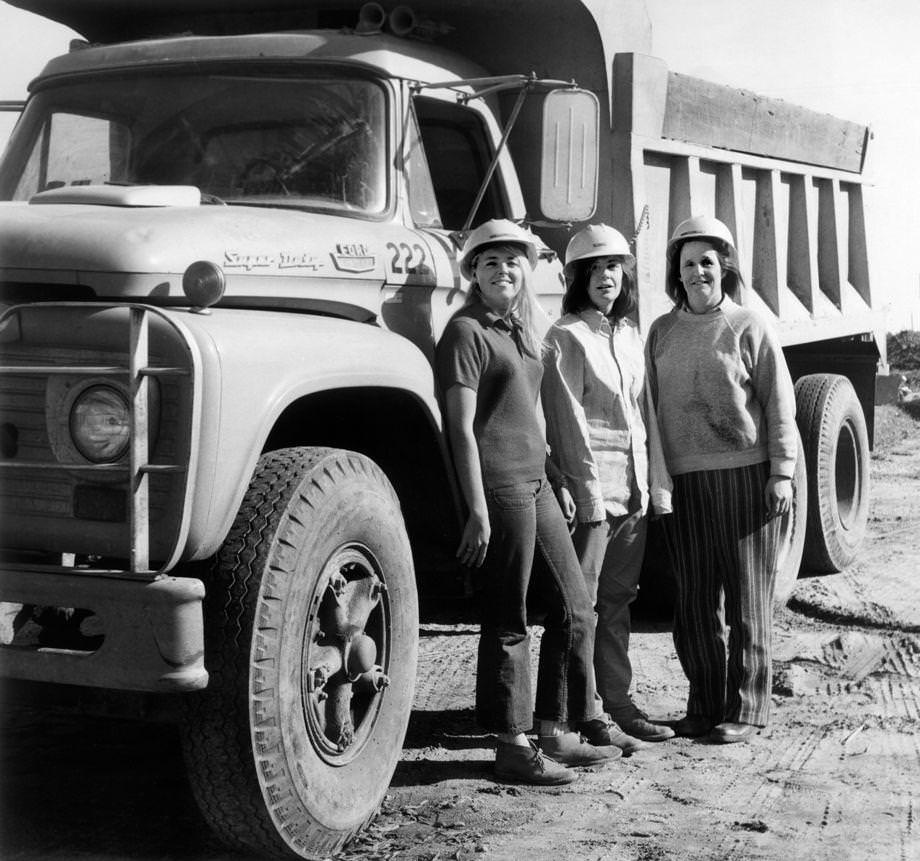 #149 Truck drivers Brenda D. Howell (from left), Sue Frye and Marion Brennan stood at a highway construction site where they worked in Gloucester County, 1971.