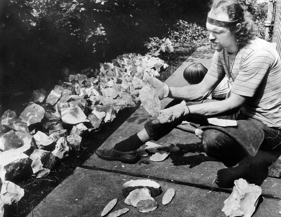 #150 Errett Callahan examined a piece of stone ahead of an experimental archaeology class that he was teaching in the Evening College of Virginia Commonwealth University in Richmond, 1971.