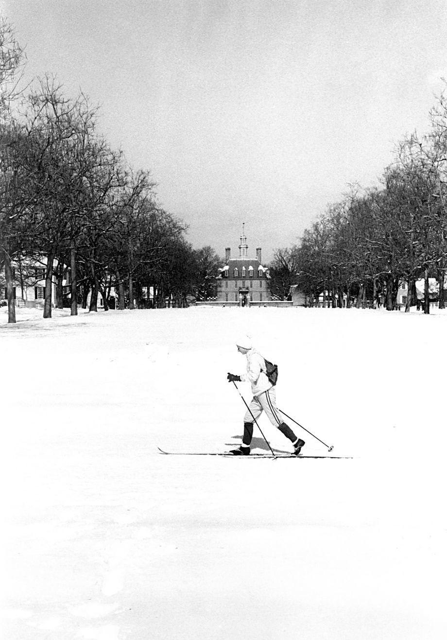 #189 Constance Ramsey, a former Richmond resident and a College of William & Mary graduate, traveled around Williamsburg on skis after a snowstorm, 1979.