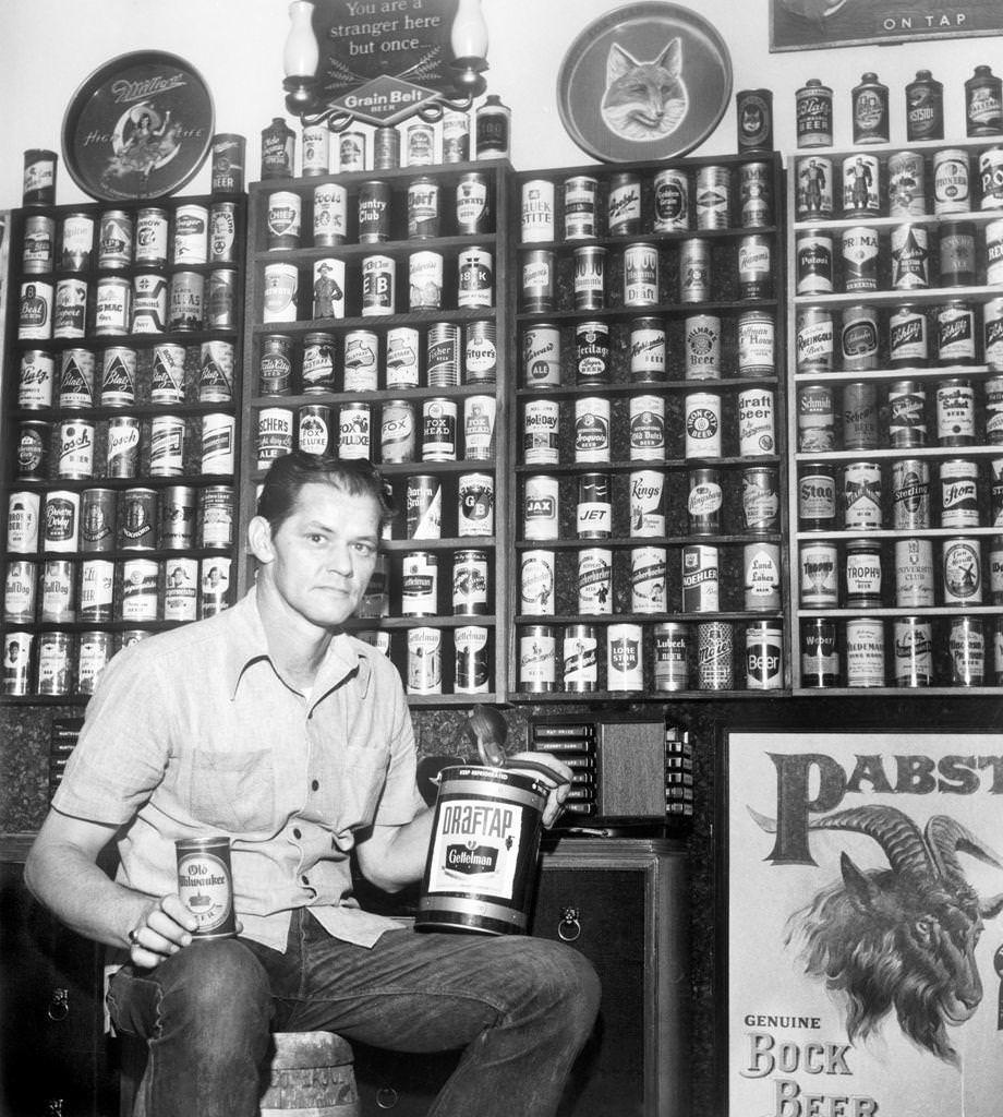 #51 Ronald J. Roller of Petersburg posed with his beer can collection, which totaled almost 1,300 after 18 years of collecting, 1976.