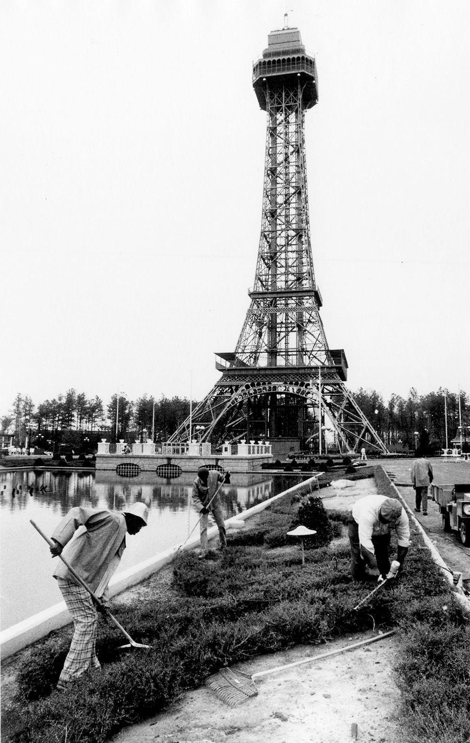 #74 Landscape workers prepared gardens in front of the Eiffel Tower replica at Kings Dominion in Doswell, 1975.