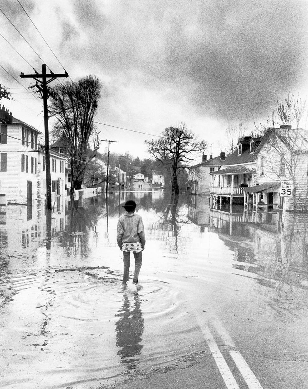 #1 Juanita Wade walked down the flooded Main Street in Columbia, a James River town in Fluvanna County near Fork Union, April 1987.
