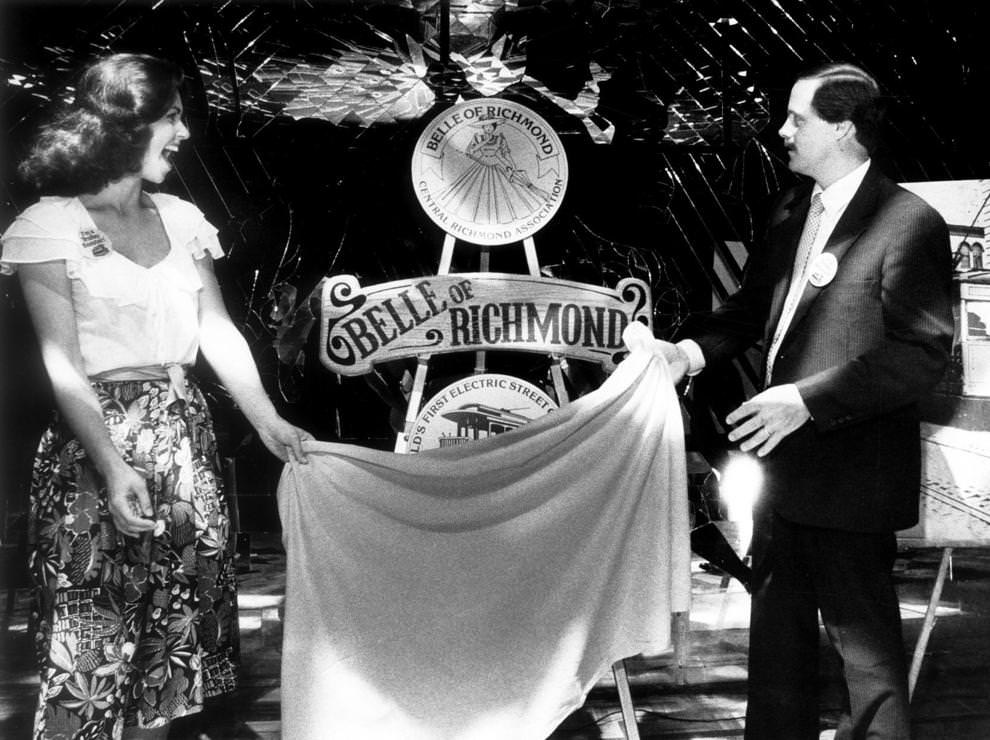 #51 Sondra Jones, Miss Virginia-USA, helped Phil Reynolds unveiled the name of the trackless trolley – Belle of Richmond – that was set to begin a five-month trial run in downtown Richmond, 1982.