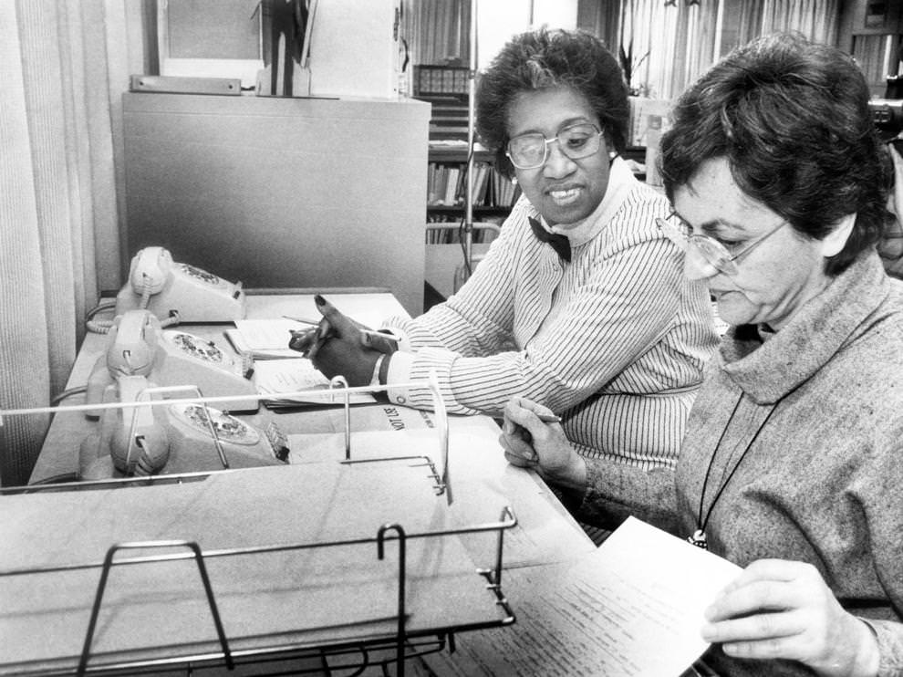 #4 Delores Green (left) and Roxie Kricorian waited for calls on the Homework Hot Line, which had just begun offering afterschool help to Richmond students, 1984