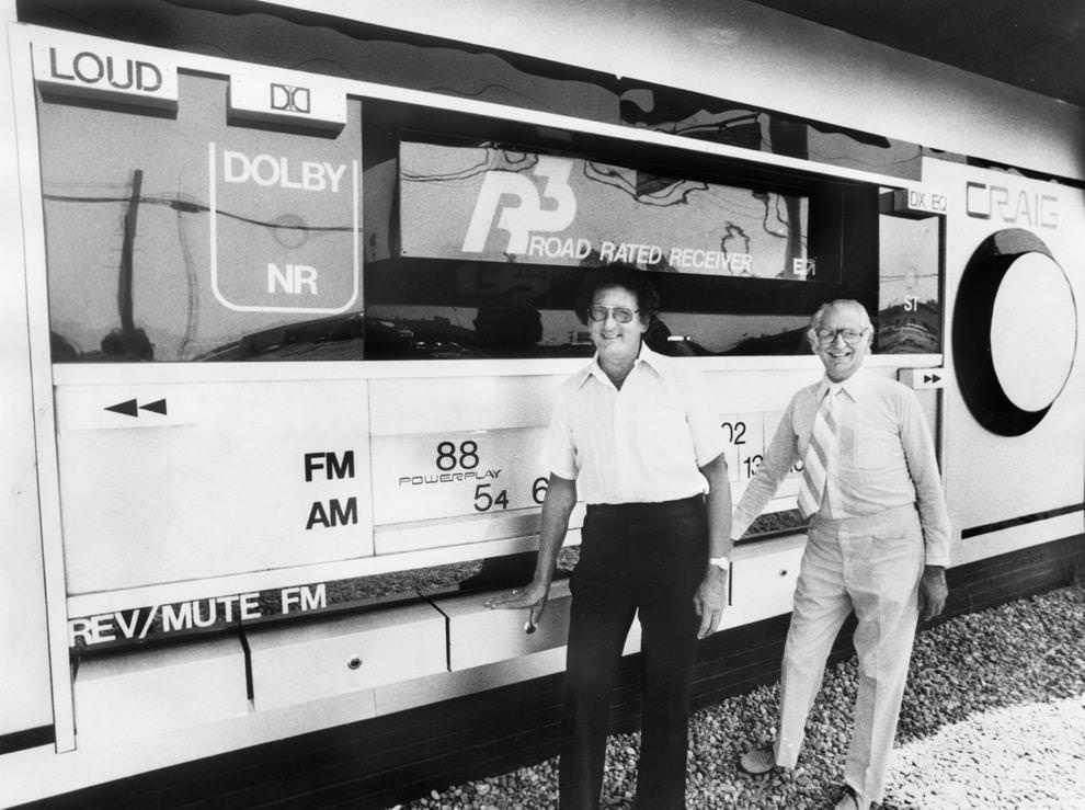 #61 Gene Ladin (left) and Alfred I. Mollen stood in front of a giant working radio they designed, 1980.