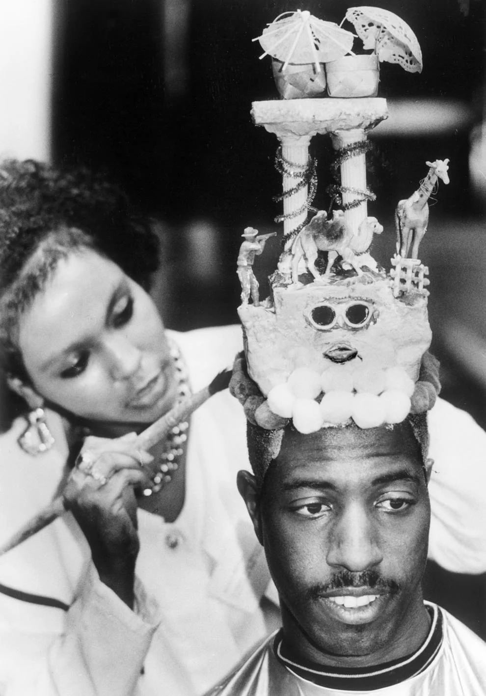 #14 Kevin Cherry got an eye-catching look from Richmond hair stylist Shelira Morrison, who said the sculpture – columns, beasts, parasols and more – sprung to her imagination, 1991
