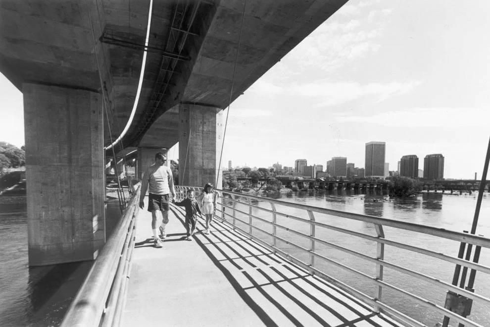 #55 A pedestrian bridge leads from Tredegar Street to Belle Isle, a new section of the James River Park system, 1991