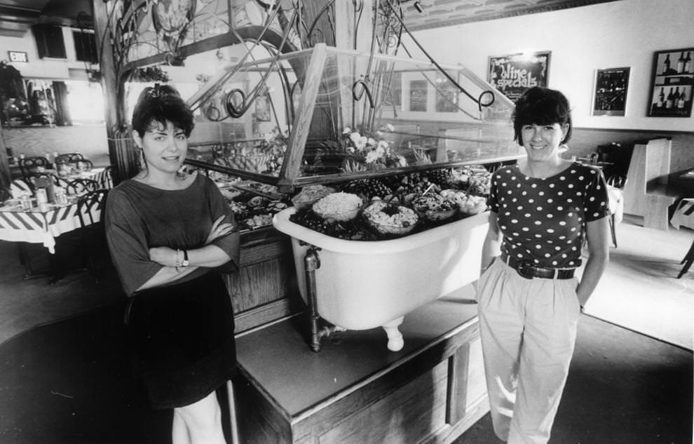 #60 The Strawberry Street Cafe’s salad bar is one of the best in town. Waitress Rhonda Ashby (left) and co-manager Julia Zenone flank the tub of treats. The cafe has an inviting atmosphere, a diverse menu and moderate prices.