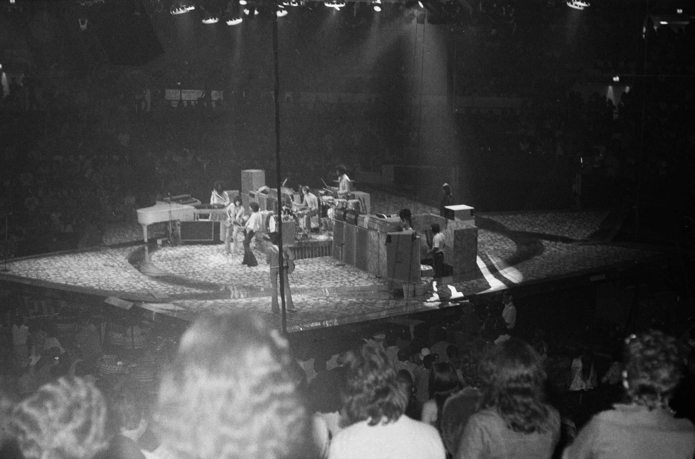 Keith Richards, Ronnie Wood, Bill Wyman, and Charlie Watts perform live on stage , 1975.